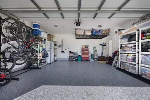 a view of a porch with chairs and a table