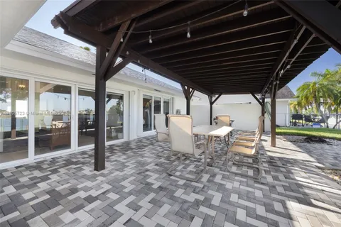 a view of a backyard with a sitting area