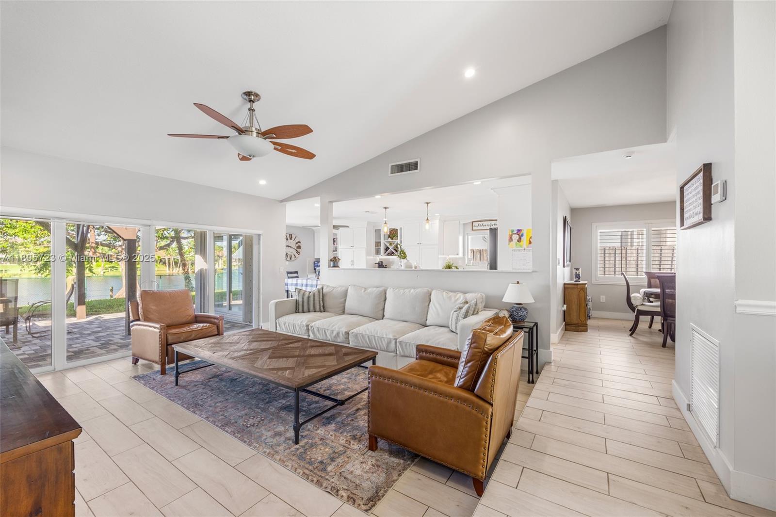 21960 Southwest 98th Avenue Cutler Bay, FL 33190 - Photo 4 of 25 a living room with furniture and large windows