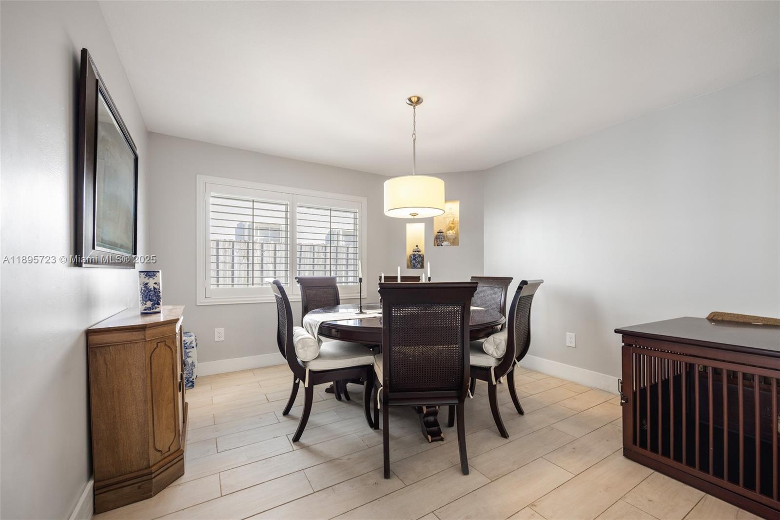 21960 Southwest 98th Avenue Cutler Bay, FL 33190 - Photo 6 of 25 a view of a dining room with furniture and window