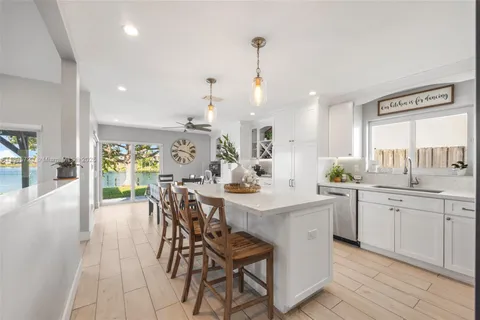 a view of a kitchen and dining table chairs