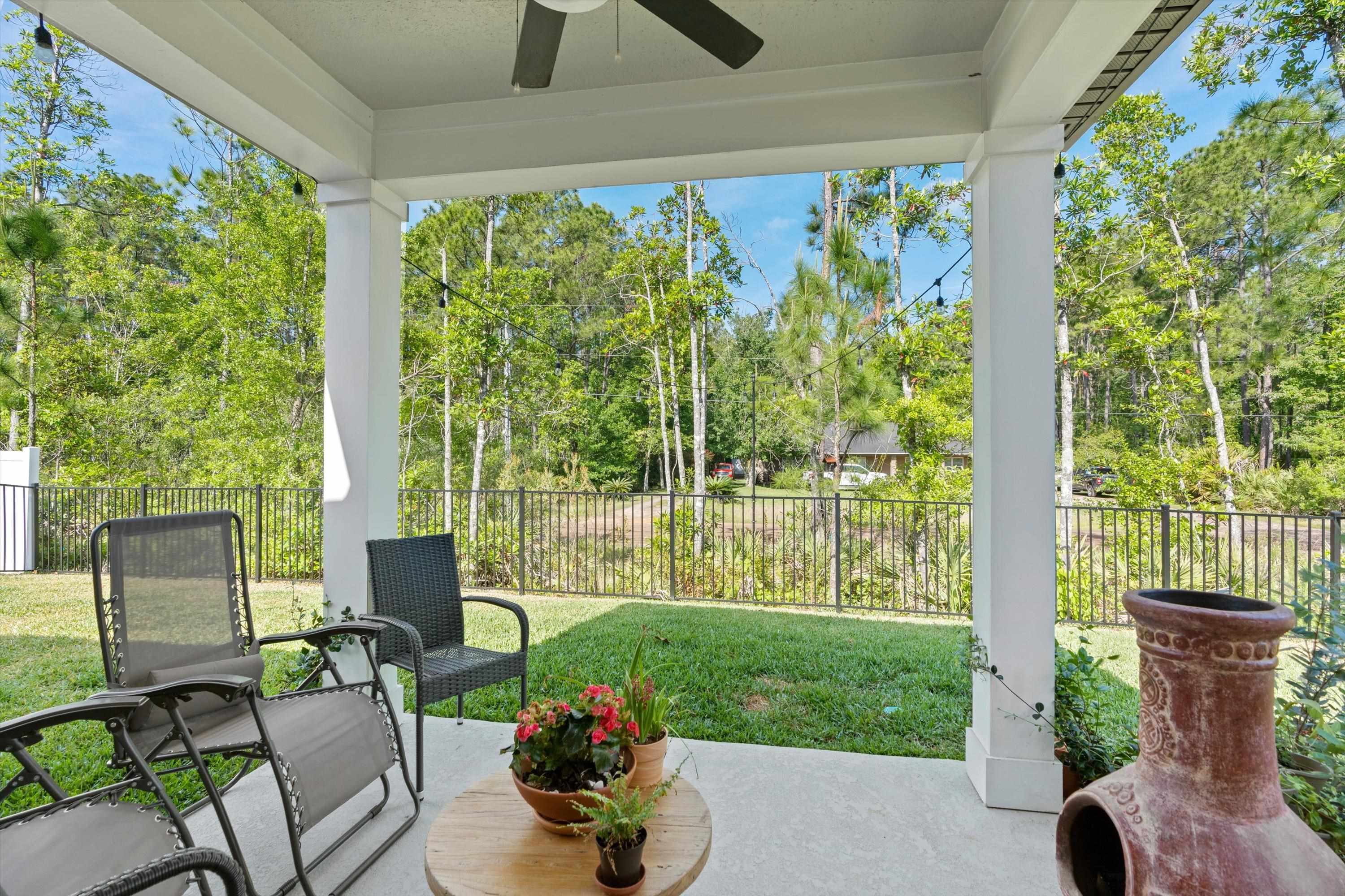 793 Morgans Treasure Road St. Augustine, FL 32084 - Photo 11 of 24 a view of a patio with chairs and plants