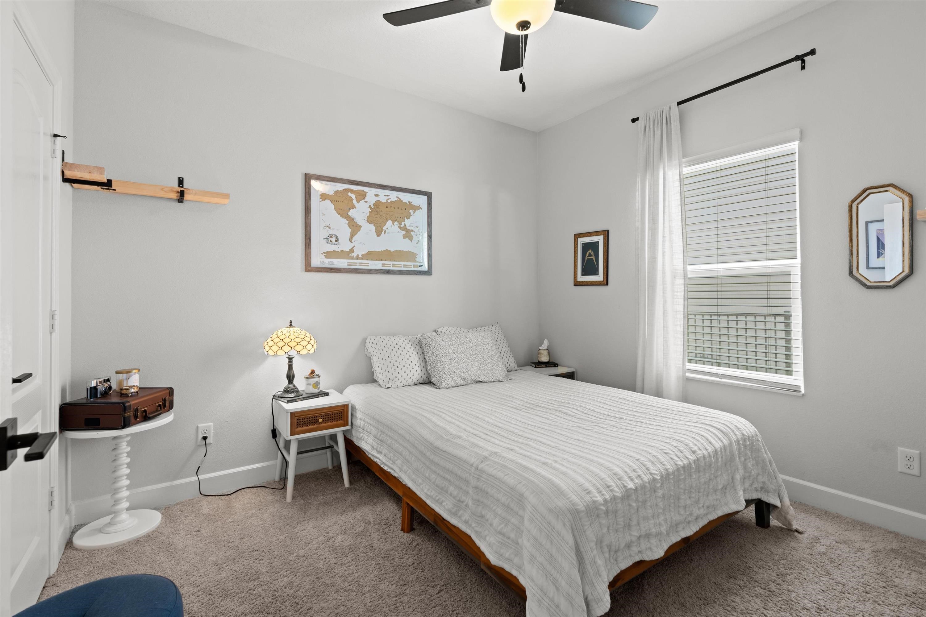 793 Morgans Treasure Road St. Augustine, FL 32084 - Photo 12 of 24 a bedroom with a bed and a chandelier