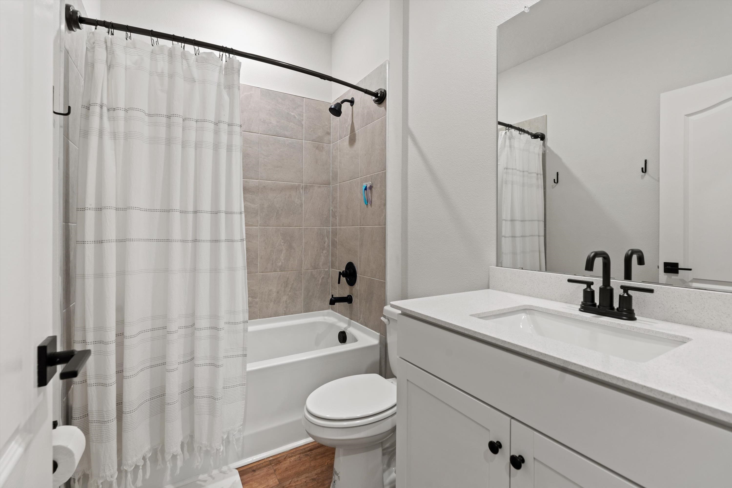 793 Morgans Treasure Road St. Augustine, FL 32084 - Photo 14 of 24 a bathroom with a sink toilet and shower