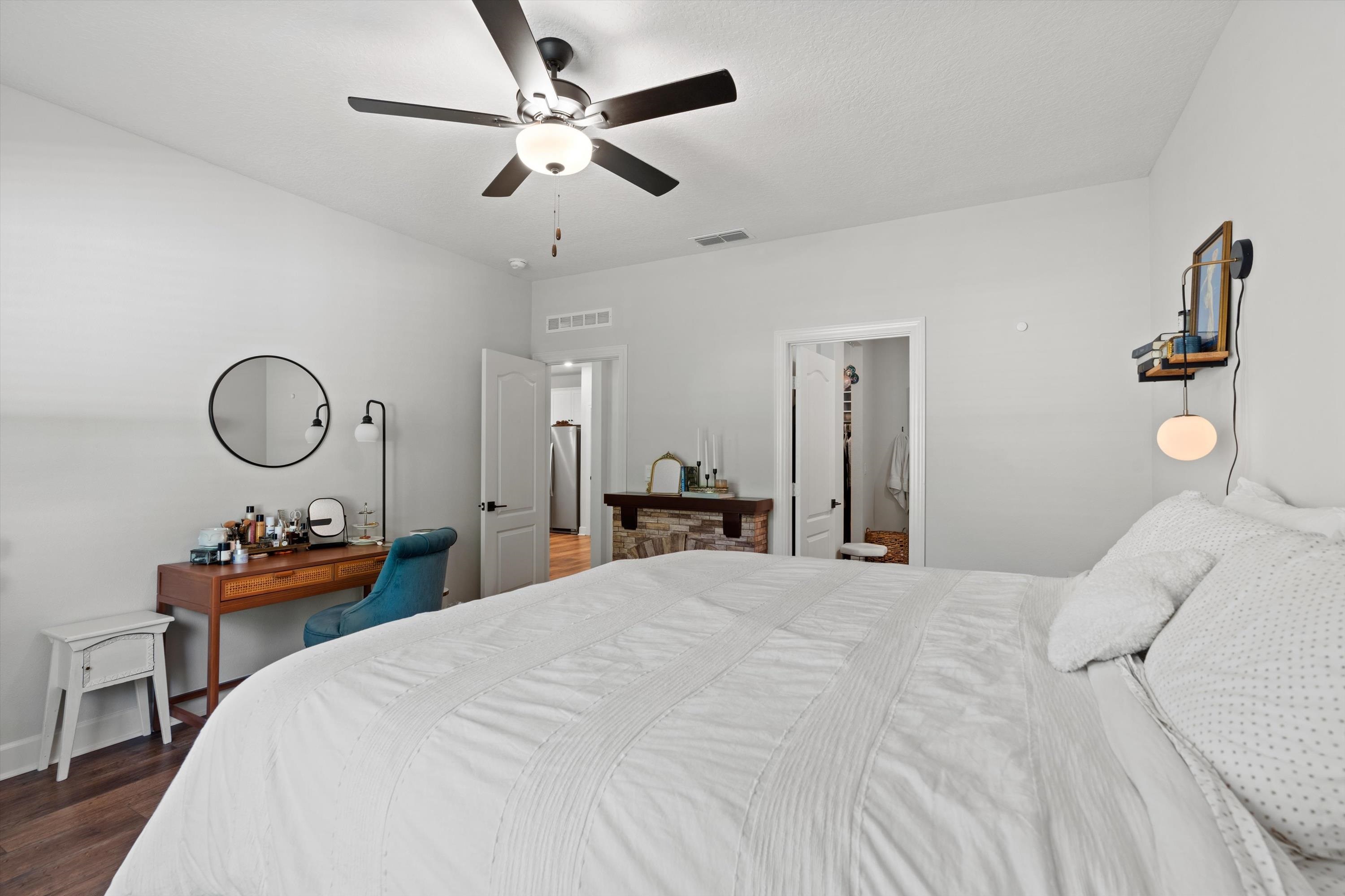 793 Morgans Treasure Road St. Augustine, FL 32084 - Photo 17 of 24 a bedroom with bed and a chandelier