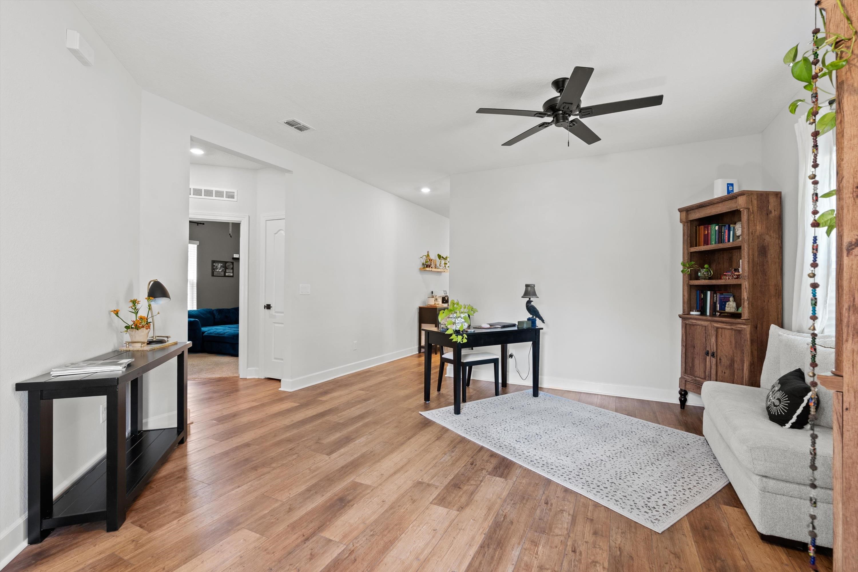 793 Morgans Treasure Road St. Augustine, FL 32084 - Photo 5 of 24 a bedroom with furniture and a wooden floor