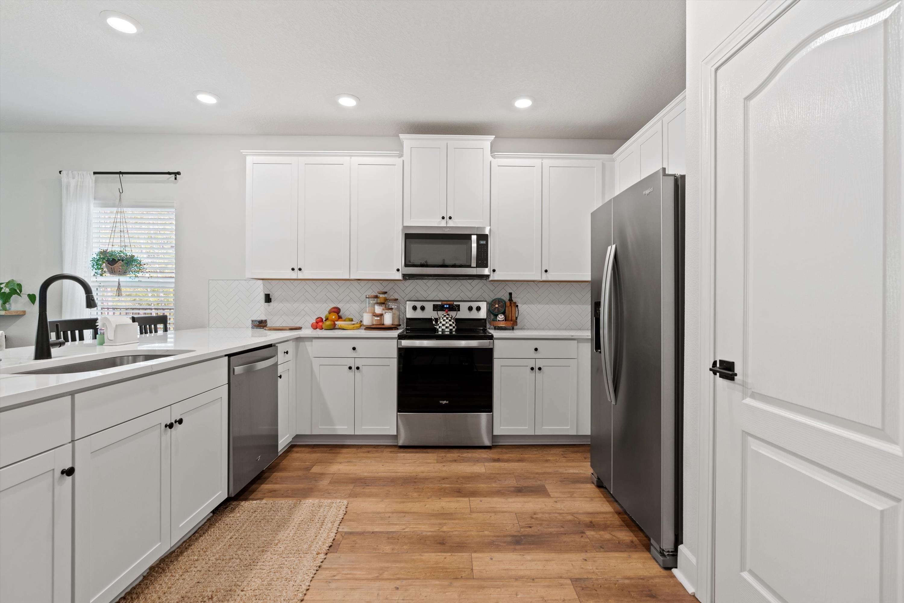 793 Morgans Treasure Road St. Augustine, FL 32084 - Photo 6 of 24 a kitchen with a refrigerator and a sink