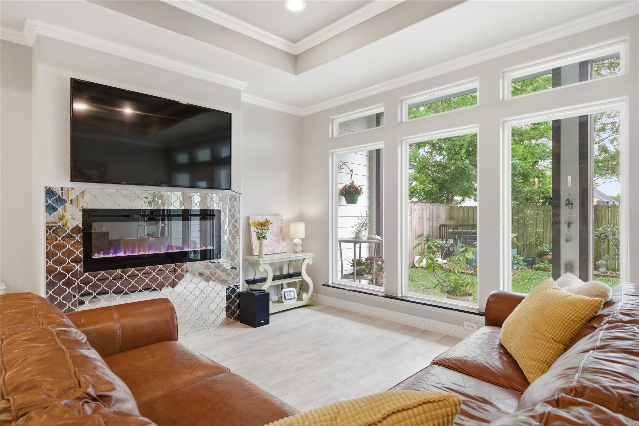 4412 New Orleans Street, Unit B Houston, TX 77020 - Photo 15 of 42 Electric fireplace with mirrored tile surround accents the living room