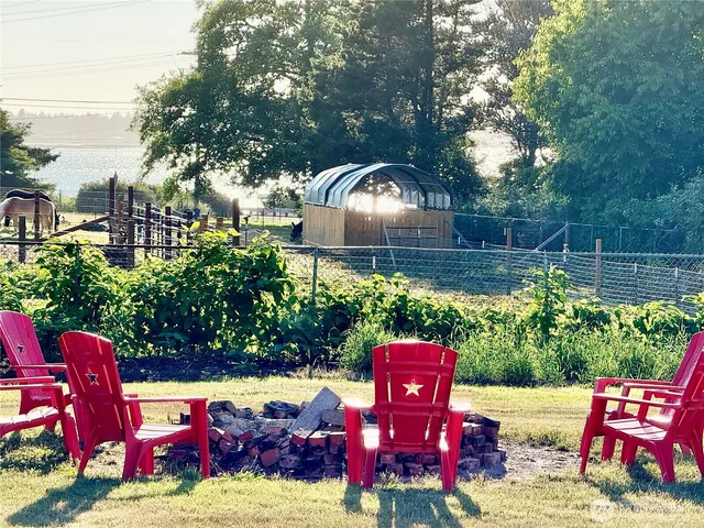 a view of a dining room with furniture and a window