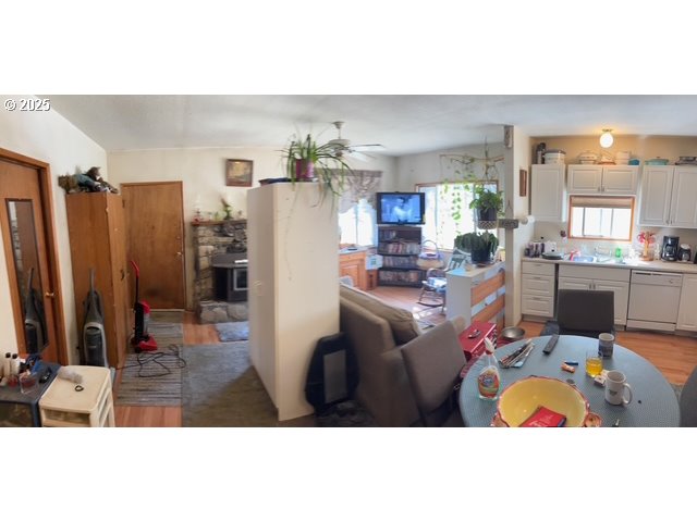 52205 Lechner Lane La Pine, OR 97739 - Photo 10 of 14 a living room with furniture a chandelier a rug and kitchen view