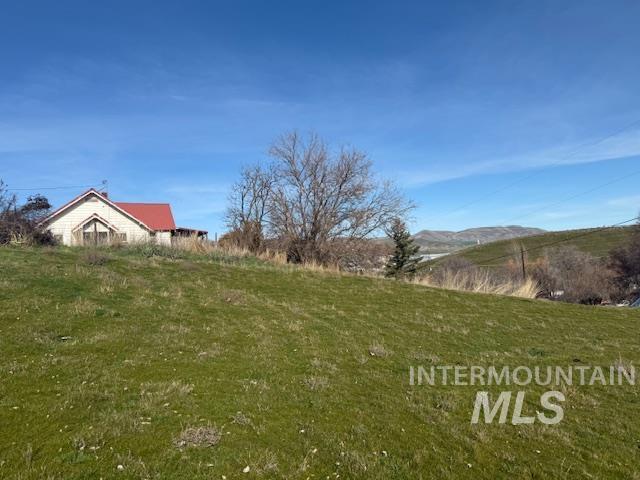 0 Silcott Street Lewiston, ID 83501 - Photo 2 of 9 View of green lawn featuring a mountain view