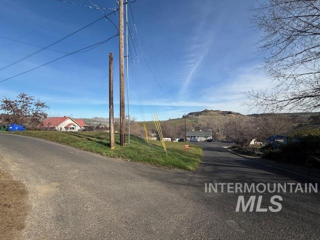 0 Silcott Street Lewiston, ID 83501 - Photo 8 of 9 View of asphalt road featuring a mountain view