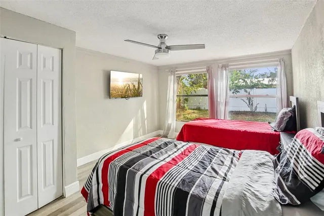 a bedroom with bed and a window