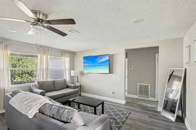 a living room with furniture and a window