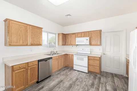 a kitchen with sink cabinets and window
