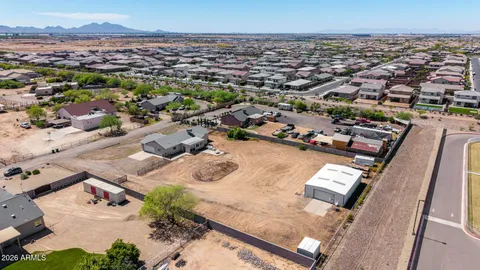 an aerial view of a house with outdoor space