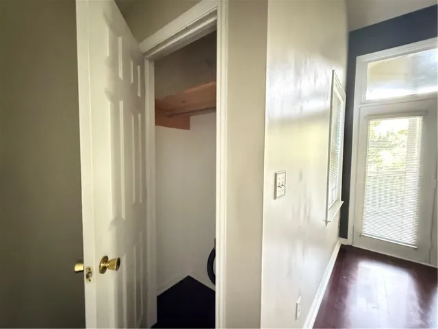 a view of a balcony with wooden floor