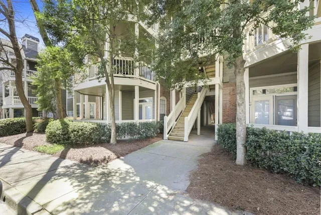 a view of a house with backyard porch and sitting area