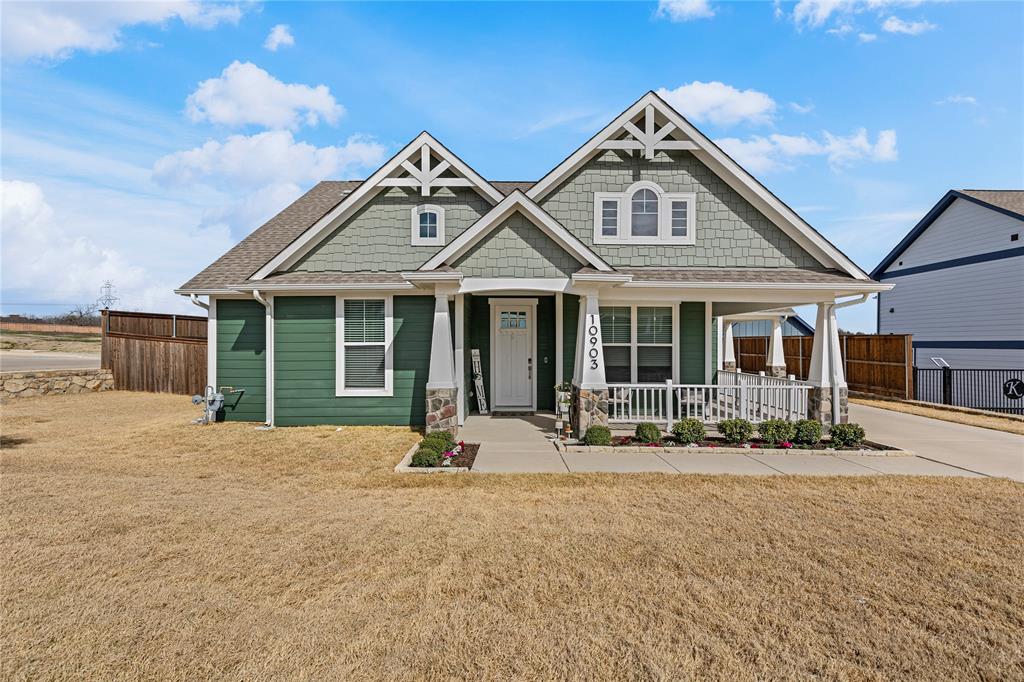 10903 Rochelle Court Midlothian, TX 76065 - Photo 1 of 1 Craftsman-style home featuring a porch, a front lawn, and fence