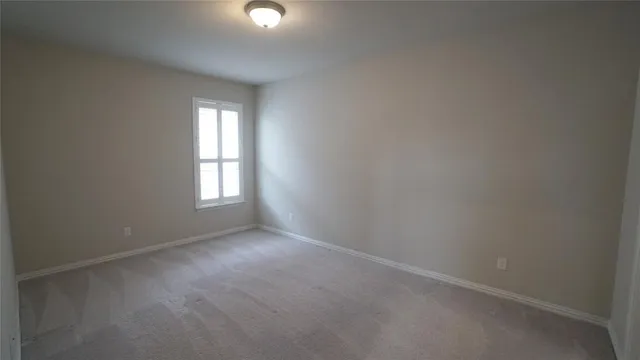 a utility room with cabinets washer and dryer