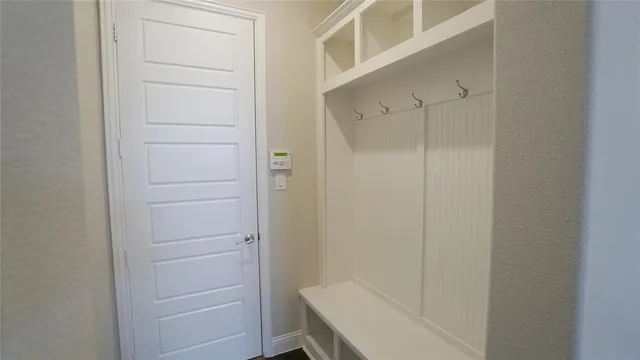 a view of front door of house and yard