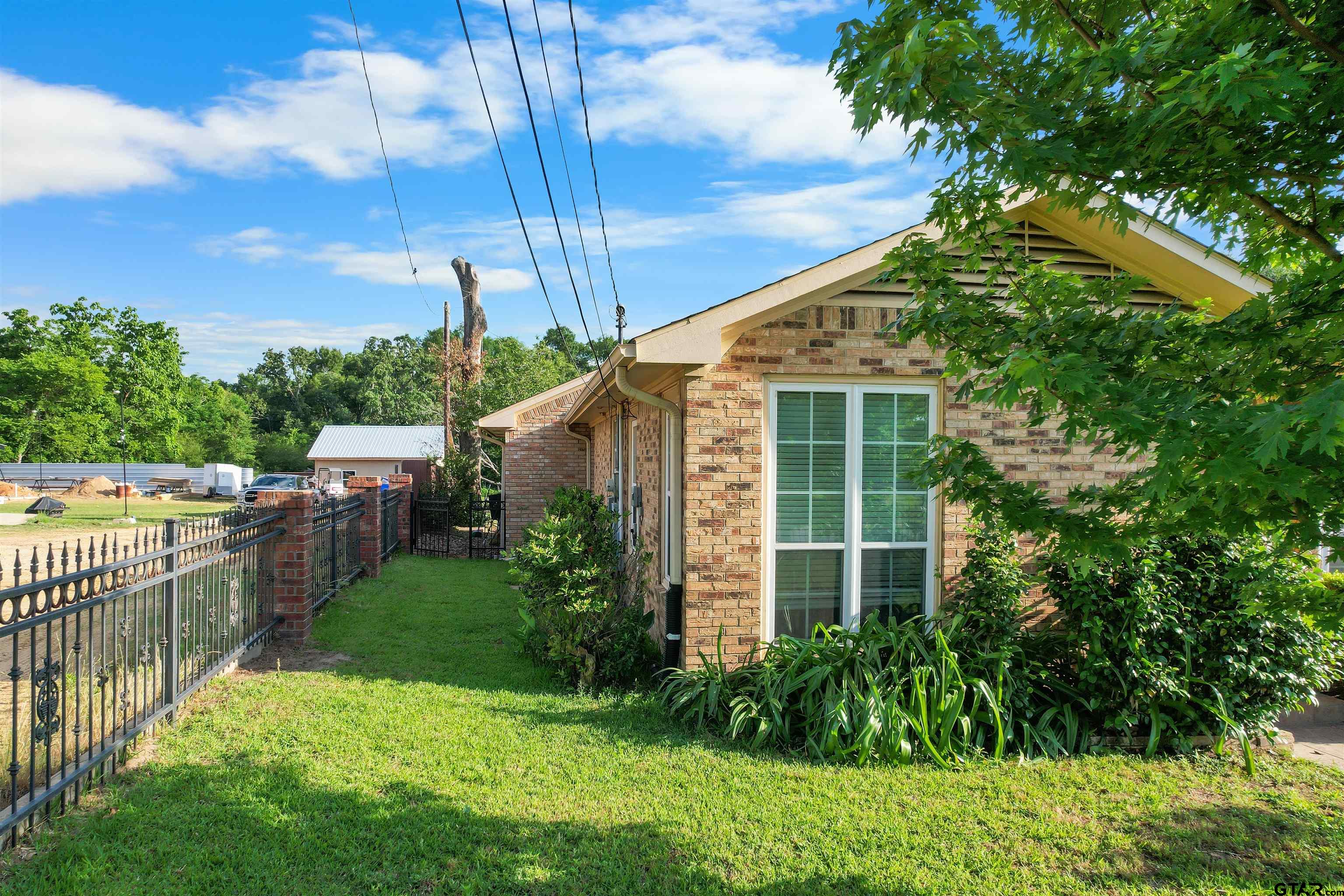 11931 State Highway 64 Tyler, TX 75704 - Photo 3 of 44 a house view with a garden space