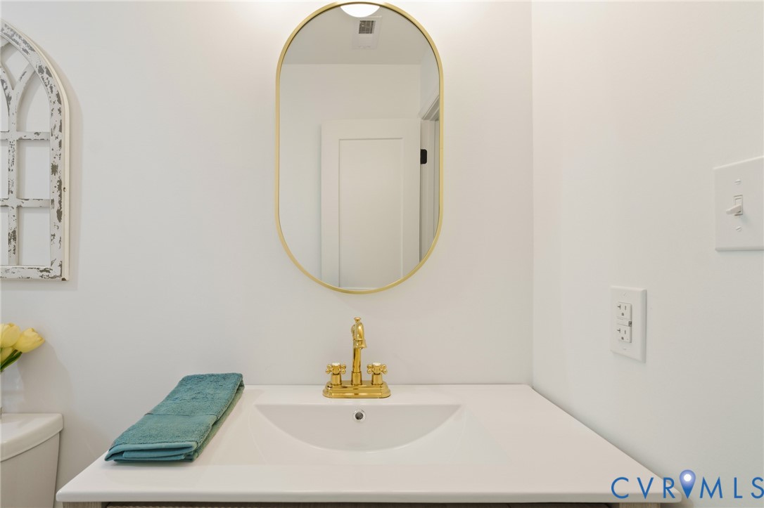 3056 Davis Mill Road Goochland, VA 23063 - Photo 33 of 46 Vanity with integrated sink, gold-finish faucet, a