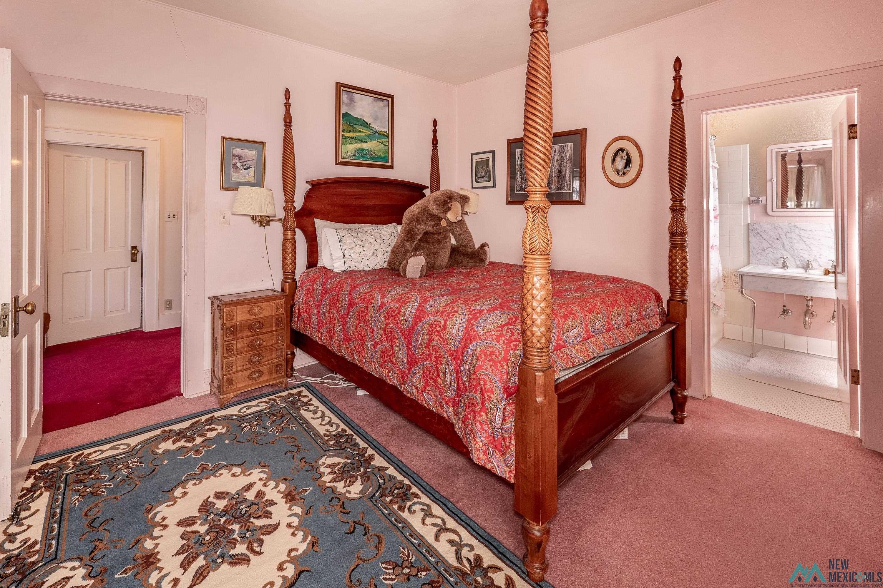 301 South 4th Street Raton, NM 87740 - Photo 21 of 78 Bedroom with carpet floors and connected bathroom