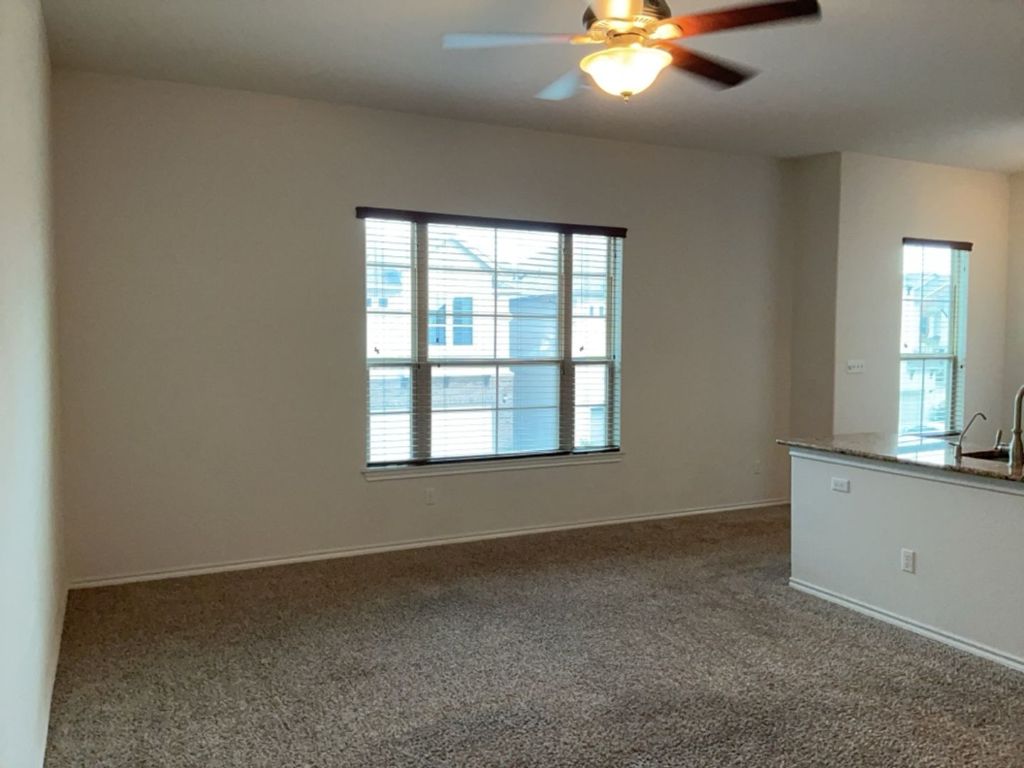 2105 Town Centre Drive, Unit 28 Round Rock, TX 78664 - Photo 14 of 28 Living room with carpet floors and ceiling fan