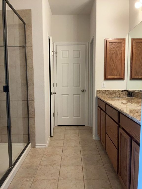 2105 Town Centre Drive, Unit 28 Round Rock, TX 78664 - Photo 23 of 28 Full bathroom with a stall shower, and double vanity