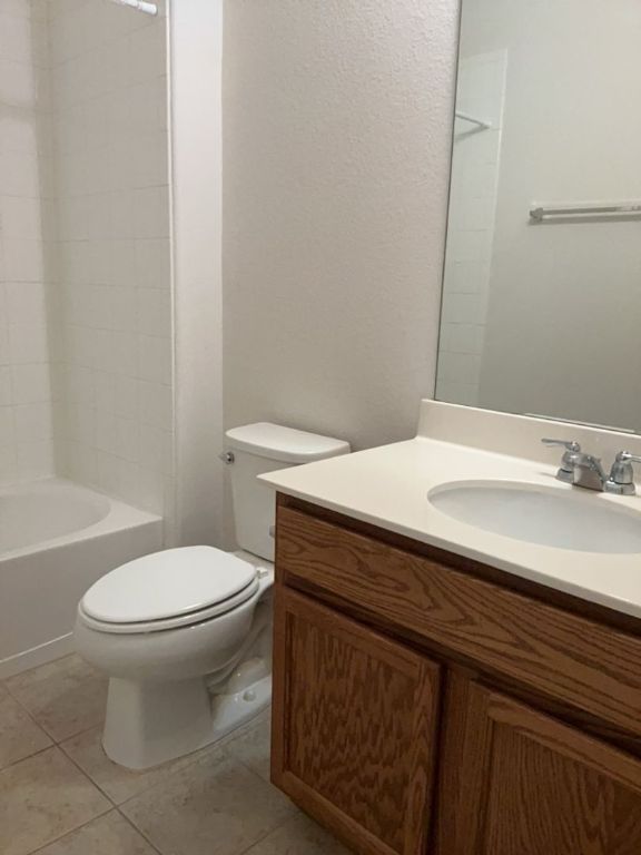 2105 Town Centre Drive, Unit 28 Round Rock, TX 78664 - Photo 6 of 28 Bathroom with vanity, and tub / shower combination