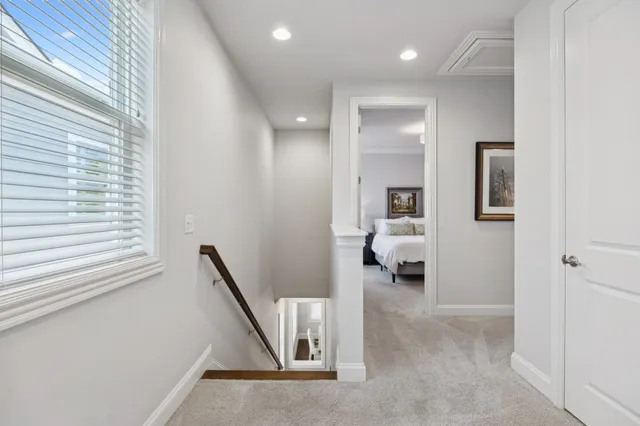 a bedroom with a bed and ceiling fan