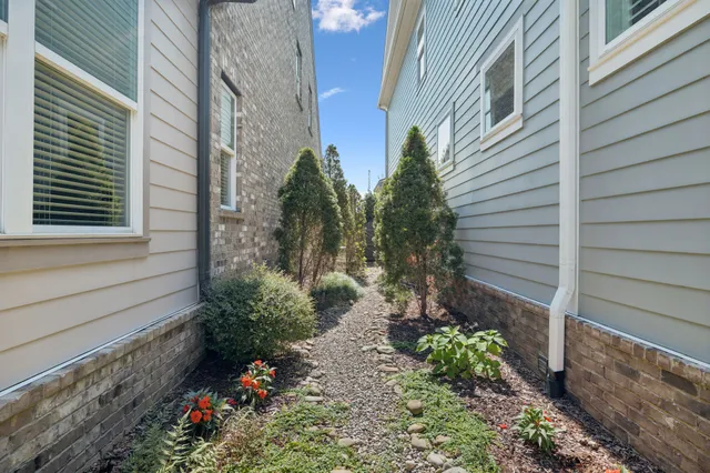 a backyard of a house with outdoor seating