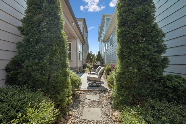 an aerial view of a house with outdoor space lake view and houses