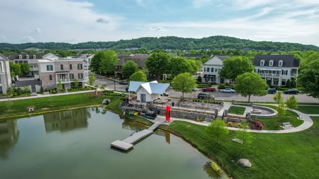 an aerial view of a house with a lake view