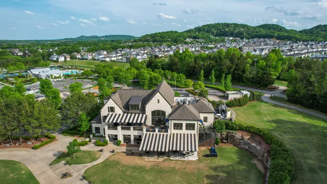 a view of a porch with furniture and garden