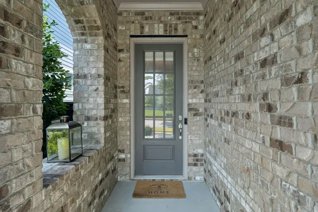 a view of a livingroom with furniture and hardwood floor