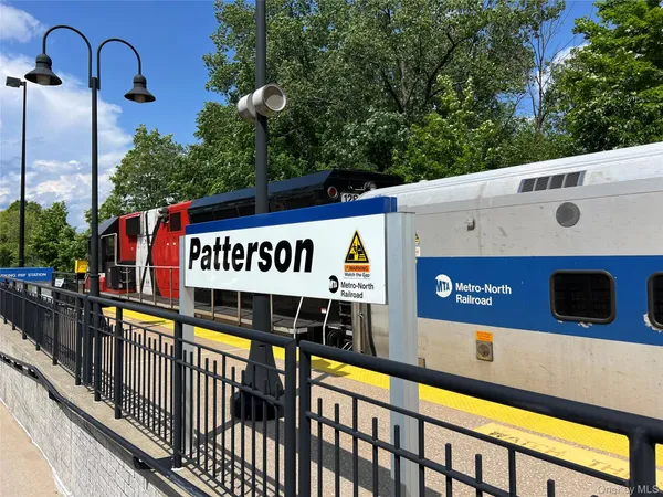 a view of a street with sitting area