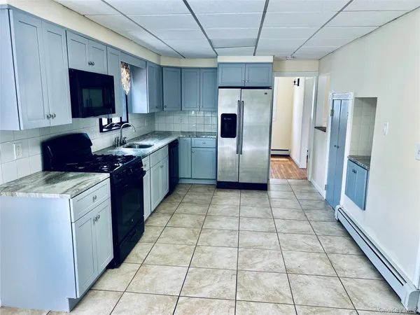 a kitchen with a cabinets and steel appliances