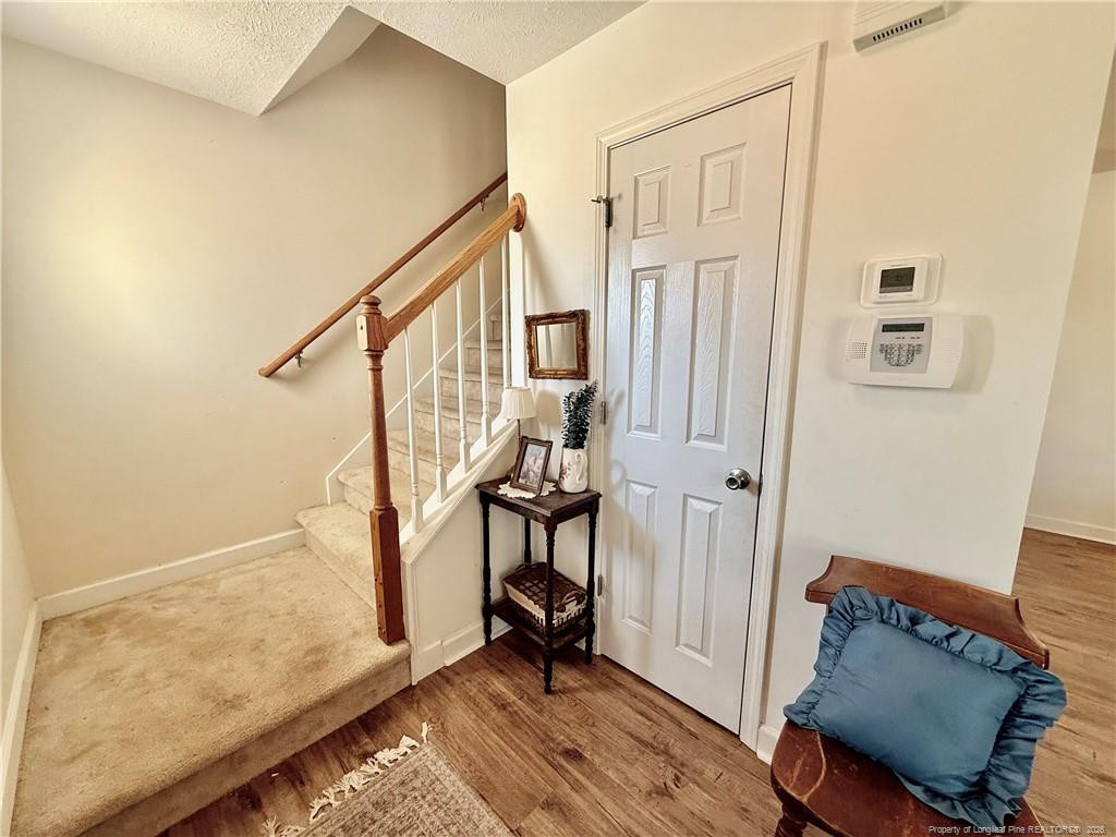 234 Pender Road Spring Lake, NC 28390 - Photo 5 of 39 a view of an entryway with wooden floor and door