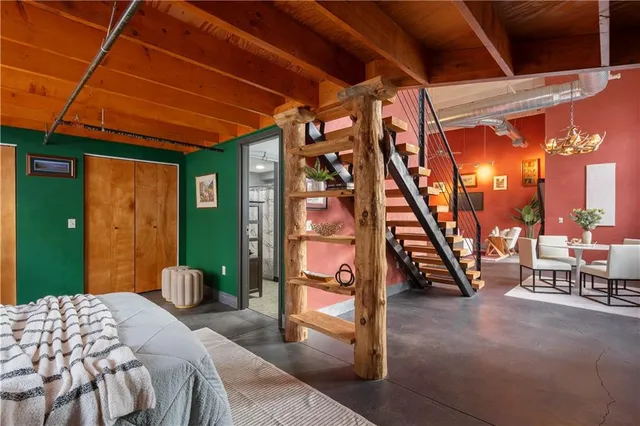 a bedroom with a bed and balcony