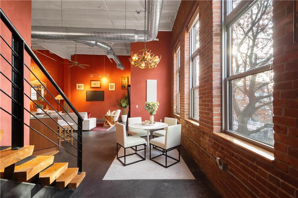 1536 Colwell Street, Unit 4 Pittsburgh, PA 15219 - Photo 17 of 43 a dining room with furniture and a chandelier