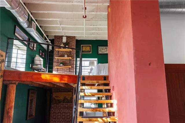 a view of swimming pool with brick walls