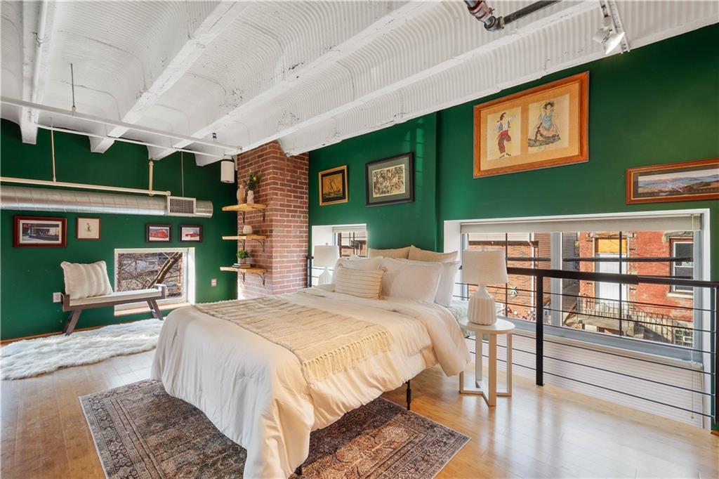 1536 Colwell Street, Unit 4 Pittsburgh, PA 15219 - Photo 19 of 43 a bed room with a bed window and table chair