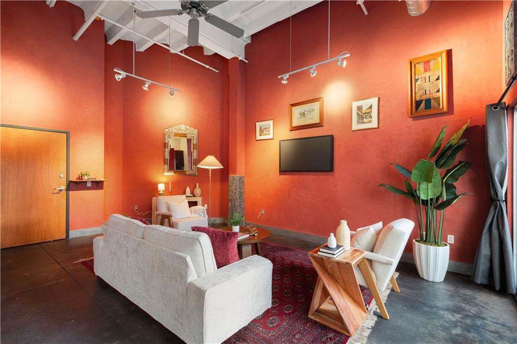 1536 Colwell Street, Unit 4 Pittsburgh, PA 15219 - Photo 2 of 43 a living room with furniture and a flat screen tv