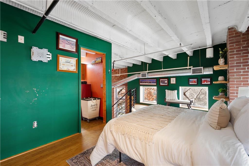 1536 Colwell Street, Unit 4 Pittsburgh, PA 15219 - Photo 22 of 43 a bedroom with a bed and balcony