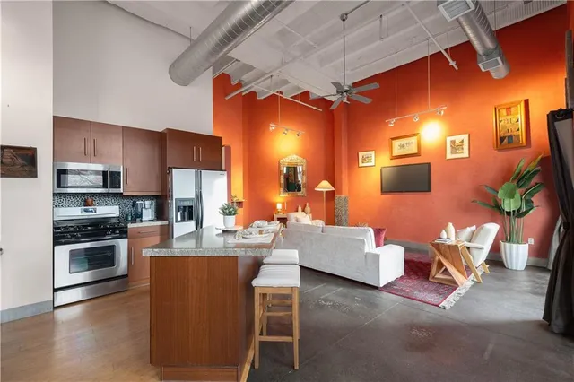 a living room with fireplace furniture and a wooden floor