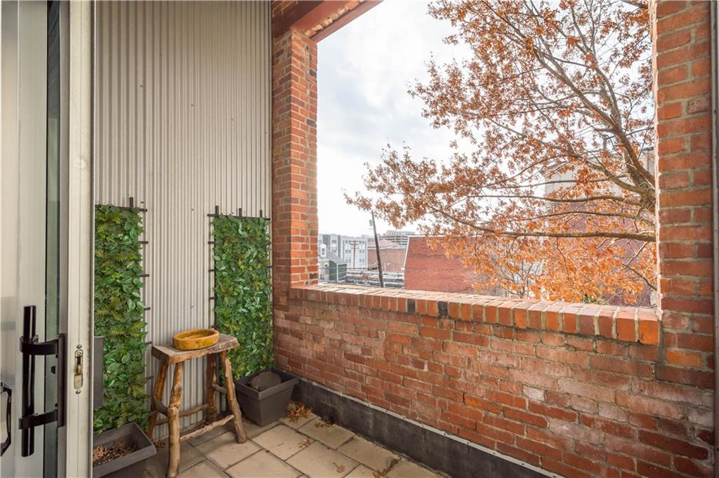 1536 Colwell Street, Unit 4 Pittsburgh, PA 15219 - Photo 28 of 43 a view of a room with a window and chair