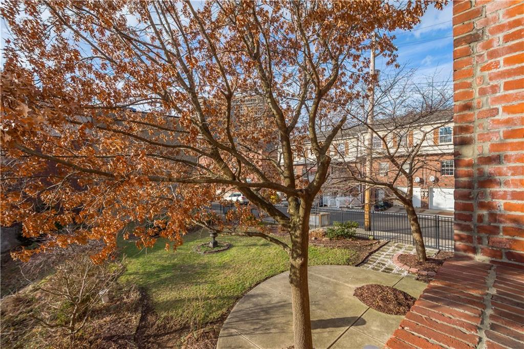 1536 Colwell Street, Unit 4 Pittsburgh, PA 15219 - Photo 31 of 43 a view of a yard with plants and trees