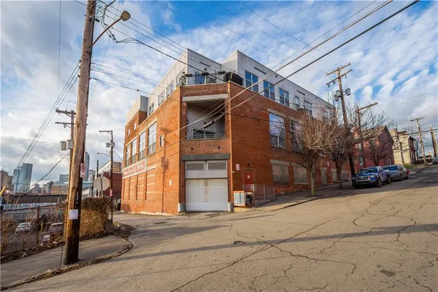 a view of a street with a building